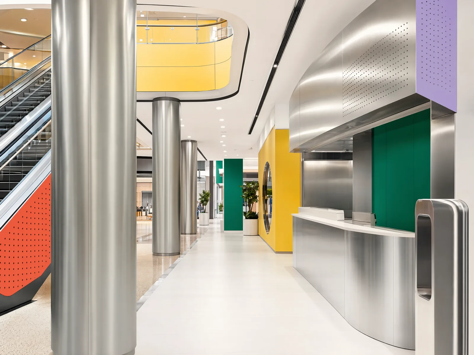 Representative shopping mall package with public-area cladding, counter front, escalator surround and floor interfaces